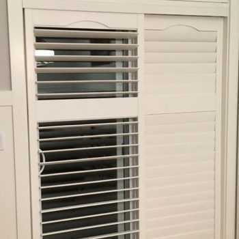Wooden shutters on a sliding door