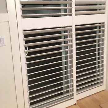 Wooden shutters on a sliding door